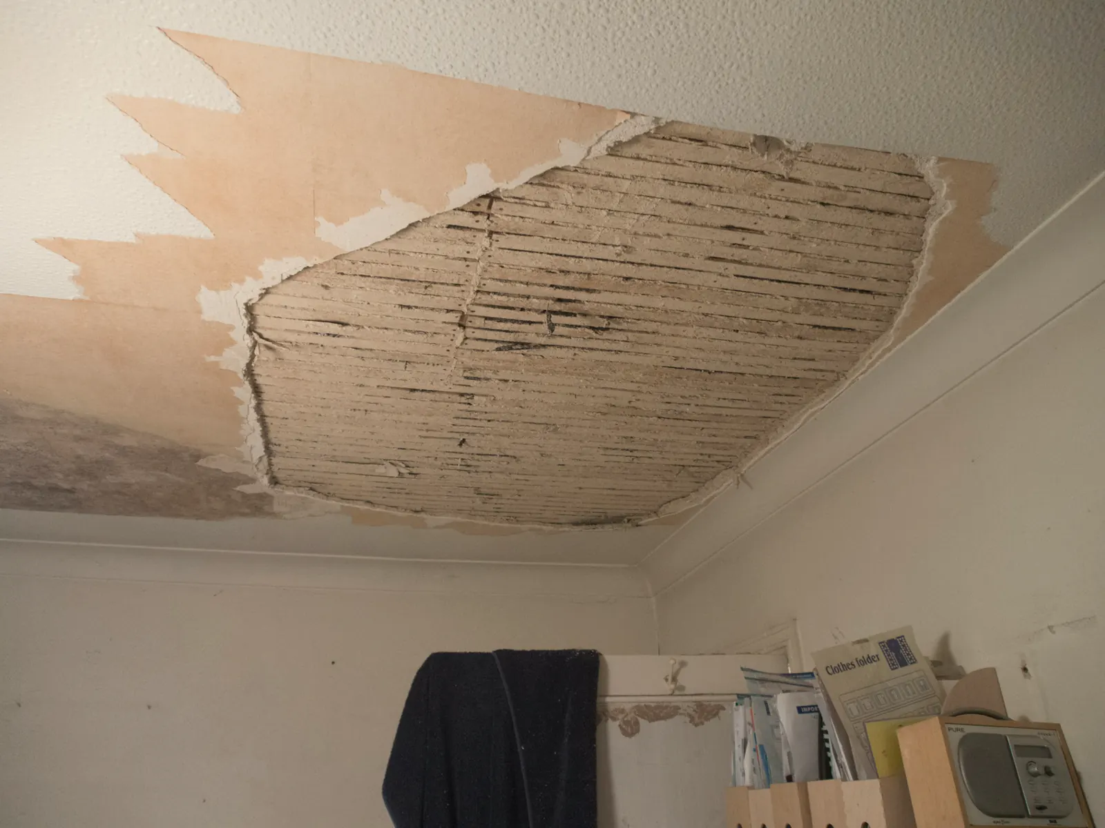 A room with the ceiling opened up after water damage