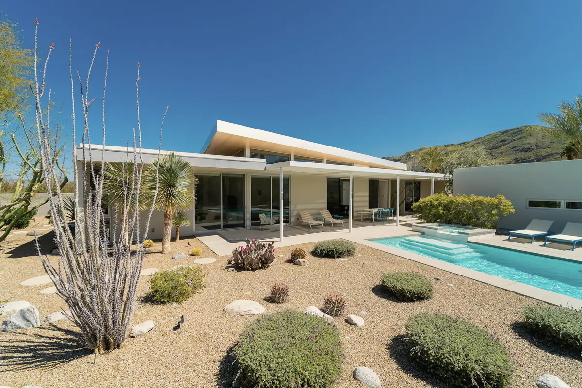 A desert home with ocotillo and a pool in the yard