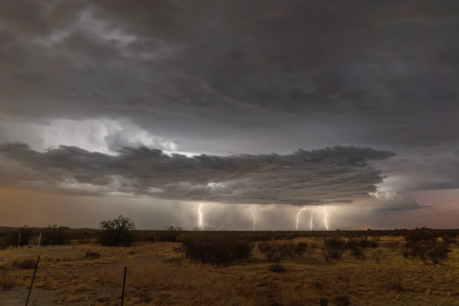Lightning from a monsoon storm over open desert